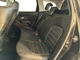 a black car with black leather seats in the back of it