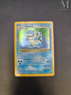 a close up of a pokemon card sitting on top of a table
