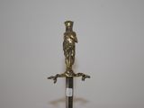 a bronze statue of a man holding a sword
