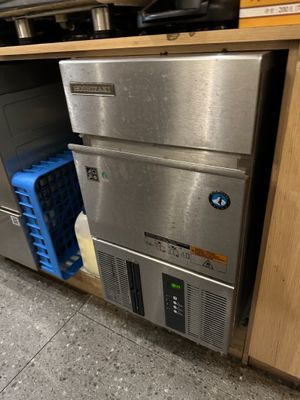 a stainless steel dishwasher in the middle of a kitchen