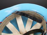 a close up of a blue hat with a leather band