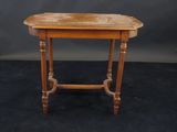 an image of a small wooden table on a black background
