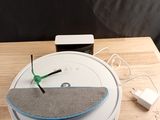 a clock sitting on top of a wooden table