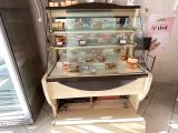 a display case that has many different types of cakes in it