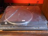 a turntable sitting on top of a wooden table
