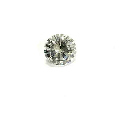 a close up of a diamond on a white surface