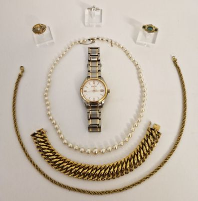 several pieces of jewelry including a watch, bracelet, and ring