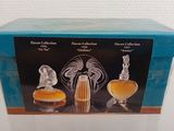 an image of a box with three perfume bottles in it