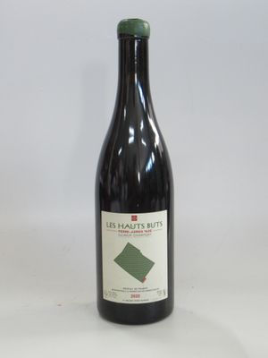 a bottle of wine that is sitting on a table