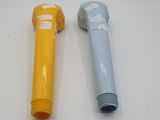 pair of yellow and blue plastic pipe holders on a white surface