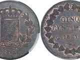 a close up of a coin with a coat of arms on it
