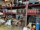 a lot of tires on the shelves in the garage