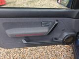 the door panel of a car with the door handle open