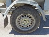 a close up of a flat tire on a truck