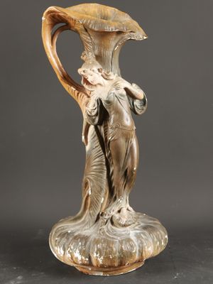 an image of a vase with a woman holding an umbrella