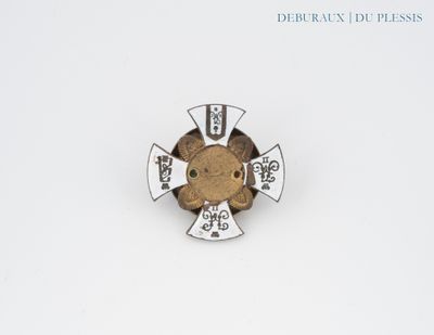 an image of a pin with a teddy bear on it