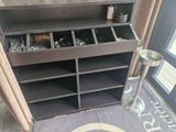 a shelf that has a bunch of items in it