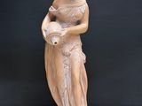 an image of a statue of a woman holding a vase