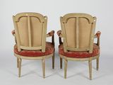 pair of antique chairs with cane back cushions and cane back arms