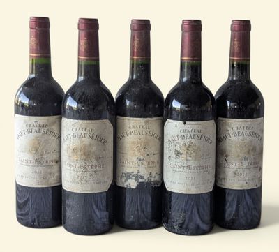 six bottles of wine are lined up in a row