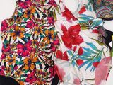 a close up of two swimsuits on a white table