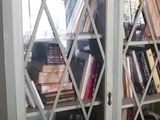 a book case with a lot of books on it