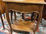 a small table with two chairs on it in a room