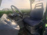 a tractor that is sitting in the grass
