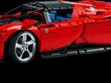 ferrari car made out of legos on a black background