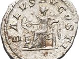 a silver coin with an image of a woman sitting on a chair