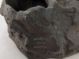 a rock that has a bird on it