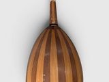 a wooden instrument that is hanging on the wall