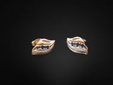 a pair of gold earrings with sapphires and diamonds