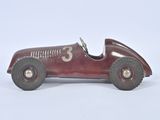 a red toy car with a number 3 on it