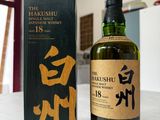 an image of a bottle of whisky sitting next to a box