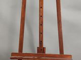 un chevalet en bois avec un siège en bois sur fond blanc