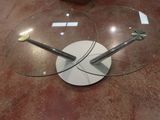 a glass table with a clock on top of it