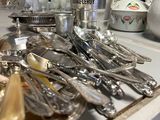 a tray of silverware sitting on a counter