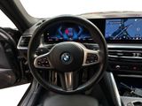 the interior of a bmw vehicle with a steering wheel and dashboard