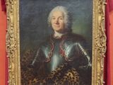 portrait of a man in armor in a gold frame