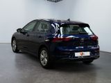 the back end of a blue volkswagen e - golf parked in a showroom