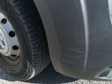 a close up of a car ' s tire on the road