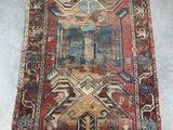 an old rug with a colorful design on it