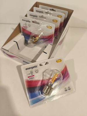 four packs of emergency light bulbs in a box on a table