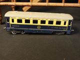 a toy train on the table next to a chair
