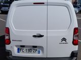 a white van that is parked in a parking lot