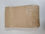 a piece of cardboard wrapped in plastic on a table
