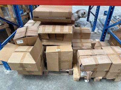 a pile of boxes sitting on a pallet in a warehouse