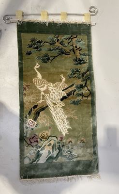 a wall hanging with a picture of a bird on it