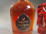 a bottle of syrup sitting next to a box of candy